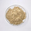 Top view of light beige ginseng powder with a dry powdered texture displayed in a clear glass dish
