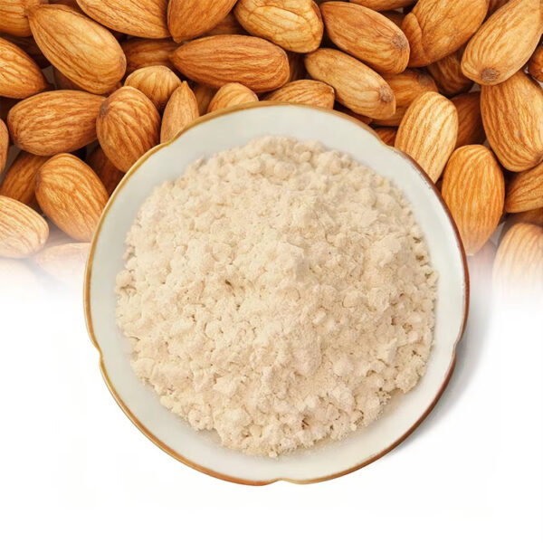 Almond powder in a bowl with whole almonds for dry mix and functional food formulation applications