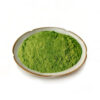 Top view of green vegetable powder for capsule, tablet, and powdered nutrition formulations