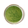 Top view of green vegetable powder for capsule, tablet, and powdered nutrition formulations