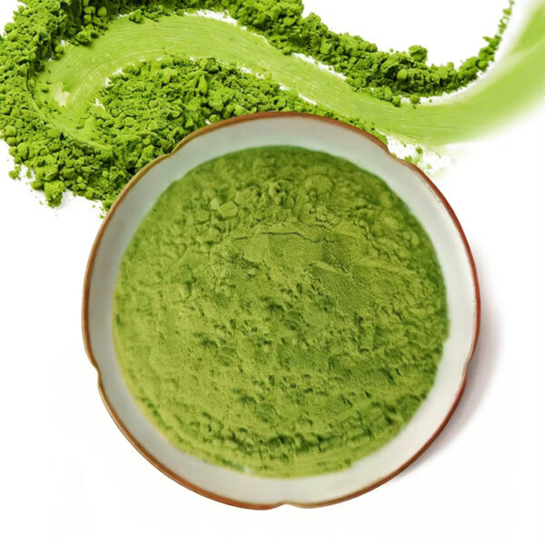 Fine matcha powder in a ceramic dish with loose green powder detail for matcha drink mix and latte formulation