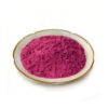 Fine red dragon fruit powder in a ceramic dish for nutrition powder and supplement blend formulation