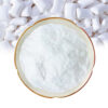 Xylitol powder in a ceramic dish with white chewing gum pieces for confectionery and chewing gum formulation
