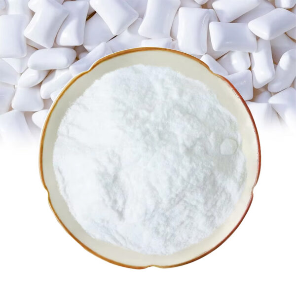 Xylitol powder in a ceramic dish with white chewing gum pieces for confectionery and chewing gum formulation