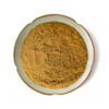 Overhead view of Chinese prickly ash extract powder showing its fine-looking golden-brown texture and slightly clumped surface