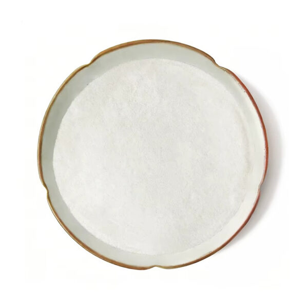 Ferulic acid powder presented as a fine white layer in a scalloped ceramic dish with a brown rim, viewed from directly above