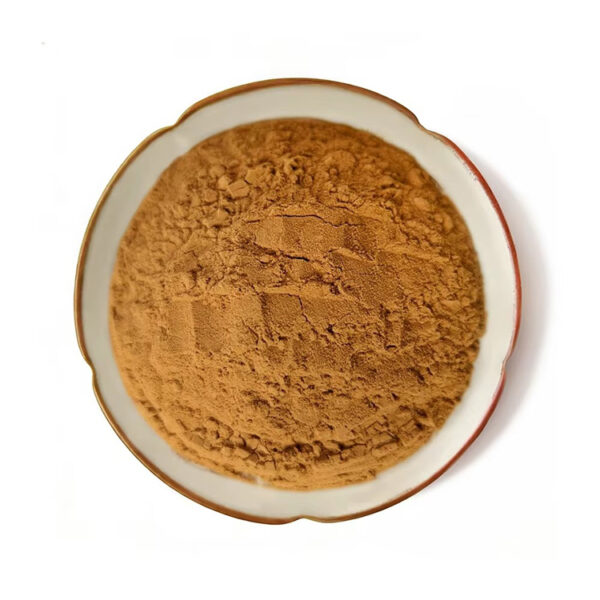 Top view of brown grape seed powder in a ceramic dish, showing the loose powdered ingredient for dry botanical blend development