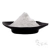 White neohesperidin dihydrochalcone powder piled in a black dish with an NHDC chemical structure in the corner