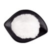 Angled top view of fine white neohesperidin dihydrochalcone powder spread across a shallow black dish