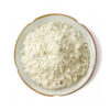 Papaya extract powder with pale cream coloring and small clumps displayed in a shallow ceramic dish from overhead