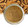 Extract powder in a ceramic dish over a background of dried, sliced polygonum cuspidatum roots