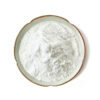 Top view of white pterostilbene extract powder in a gold-rimmed ceramic dish