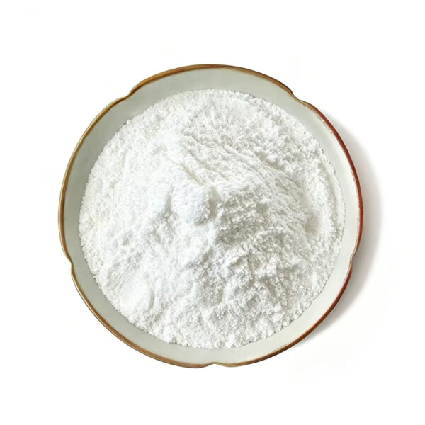 Top view of white pterostilbene extract powder in a gold-rimmed ceramic dish