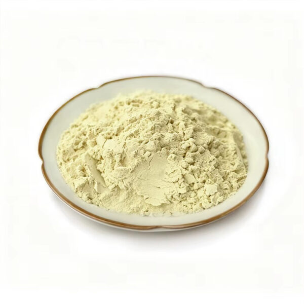Pale yellow pumpkin seed extract powder in a white ceramic dish, viewed from the side with its lightly clumped texture visible