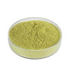 Side view of a glass dish containing yellow-green quercetin powder with a gently mounded surface and fine texture